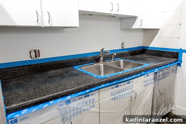 Resurface Laminate Countertops Yourself for Under $50 5 Tape off the laminate countertop to prep the surface for countertop coating