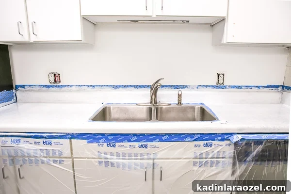 Resurface Laminate Countertops Yourself for Under $50 8 In process photo of DIY resurfacing of laminate counter.