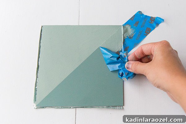 Remove painter's tape to reveal the final pattern for the DIY budget backsplash.