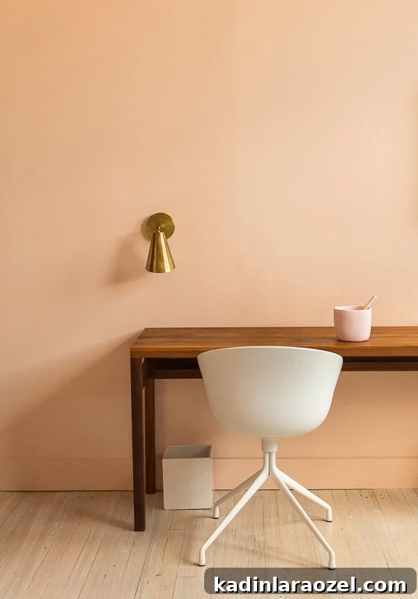 king room with pink walls and minimal decor, at the Quirk Hotel in Richmond, VA