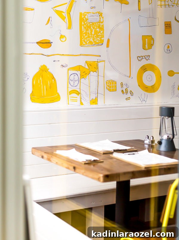 small independent restaurant in Richmond, Virginia with white walls and yellow illustrative accents