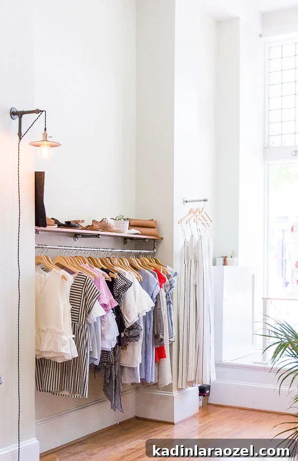 small women's clothing shop in Richmond, Virginia with tall ceilings and white walls with wood flooring