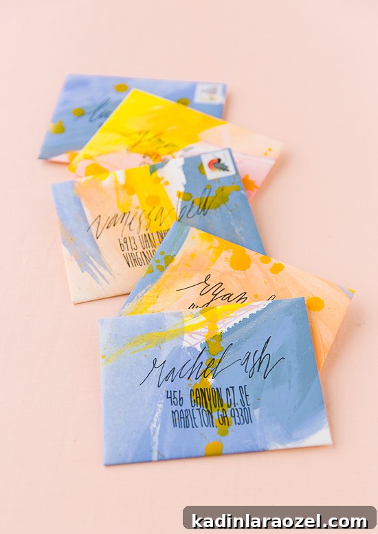 DIY Painted Envelopes: Step-by-Step Guide to Stylish Mailables 5 Painted envelopes in abstract patterns of blue and yellow