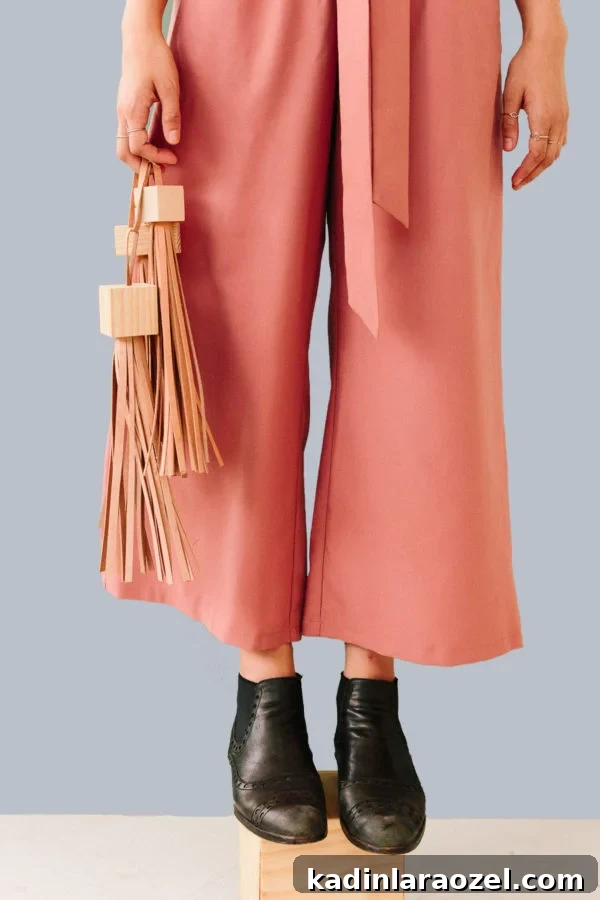 DIY Statement Tassels Using Wood Blocks and Leather — Step-by-Step Guide 11 Those statement tassels are actually a DIY. Click through for the tutorial.