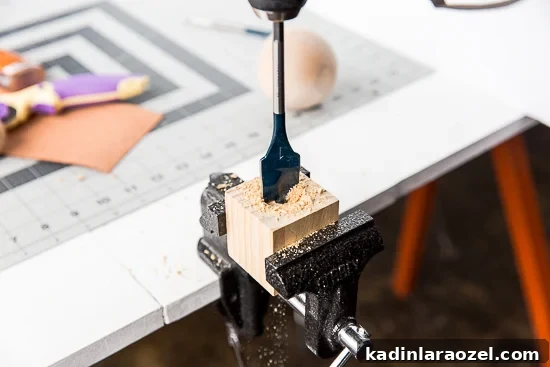 DIY Statement Tassels Using Wood Blocks and Leather — Step-by-Step Guide 5 Drilling holes for DIY statement tassels.