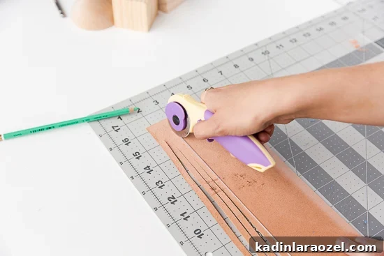 DIY Statement Tassels Using Wood Blocks and Leather — Step-by-Step Guide 6 Cutting leather with rotary cutter for tassels.