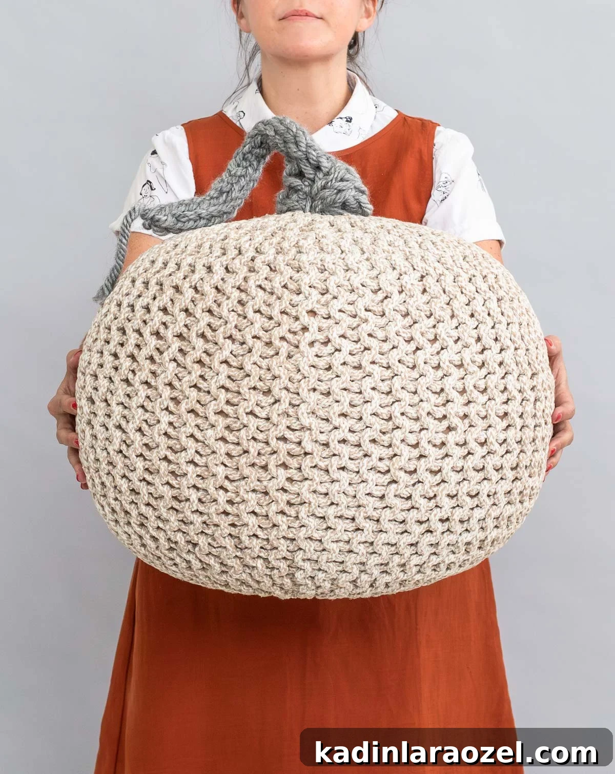 A neutral color giant knit pumpkin for Halloween
