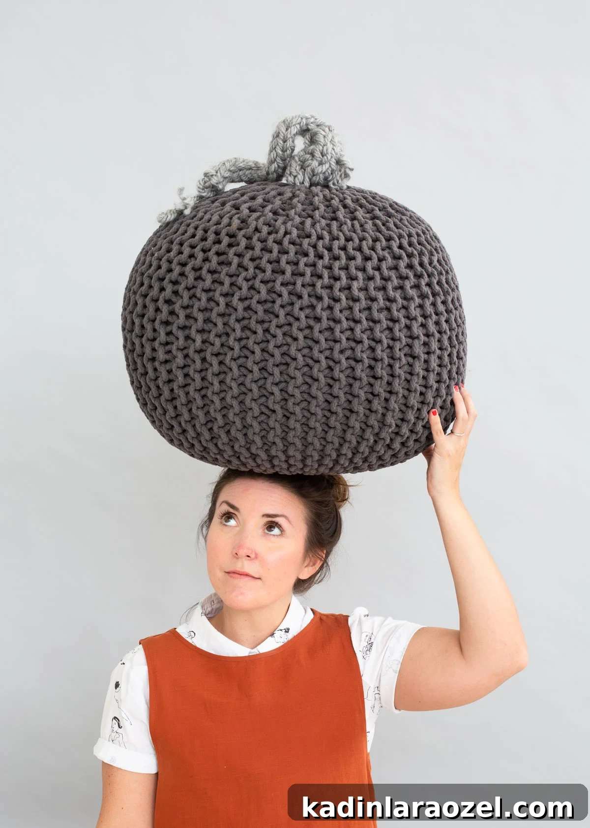 Giant knit pumpkin in monochromatic grey