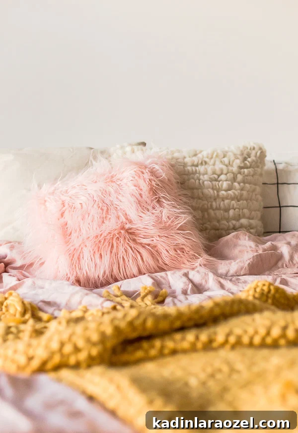 A light-filled, cozy bedroom gets a DIY upgrade with a faux fur pillow project