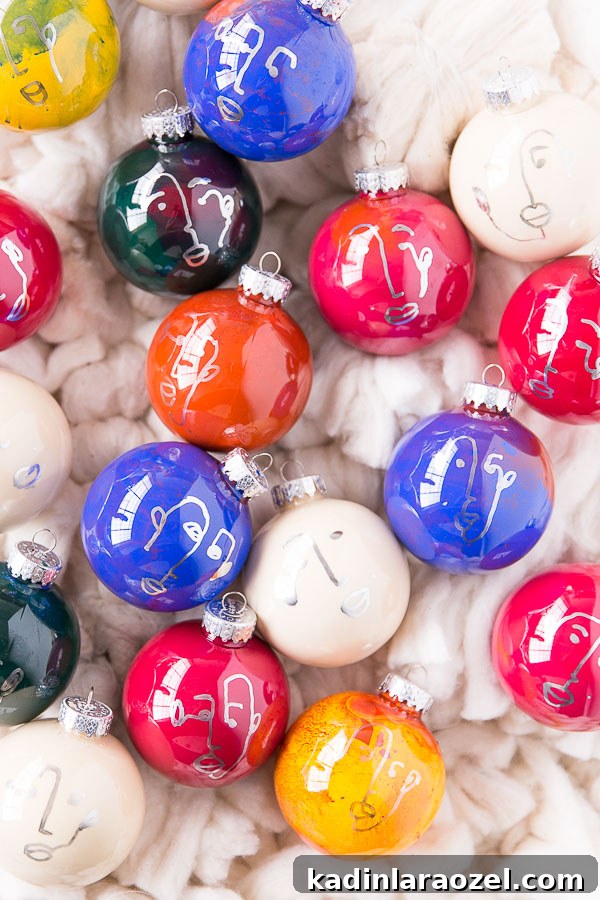 Glass ornaments in different colors and designs, last out on fluffy white rug