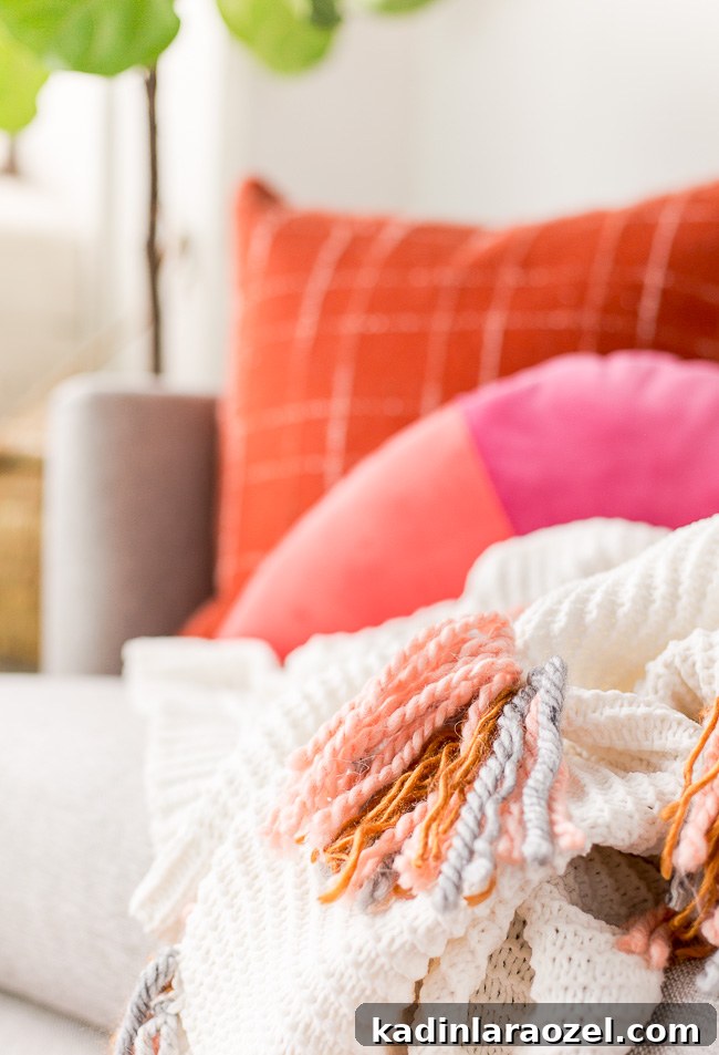 DIY Tassel Blanket Tutorial for a Cozy Winter Home 3 Cozy up with this DIY tassel blanket for winter. It's an easy project, with a little yarn and an existing knit blanket. Click through for the step by step instructions. #diy #blanket #tassel #interiors #homedecor #housewares #cozy #winter