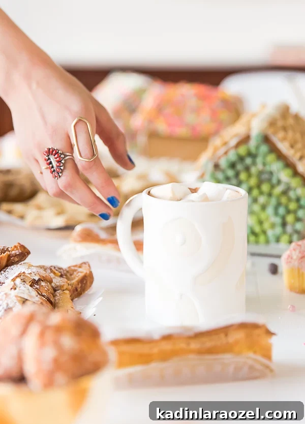 This holiday cookie swap has a super easy spiked hot chocolate recipe, with giant marshmallows. Yum! Click through for the recipe. #hotchocolate #cocktail #wintercocktail #winter #cookieswap #sweets #dessert #christmas #holiday