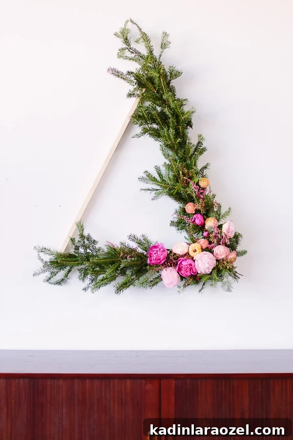 How to Make a Giant DIY Wreath (over 3 ft tall) Shaped Like a Triangle for Winter and/or Christmas. #holiday #christmas #wreath #flowers #floralwreath