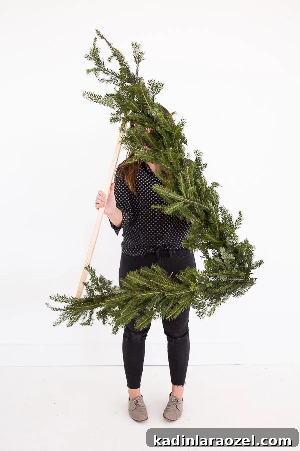 How to Make a Giant DIY Wreath (over 3 ft tall) Shaped Like a Triangle for Winter and/or Christmas. #holiday #christmas #wreath #flowers #floralwreath
