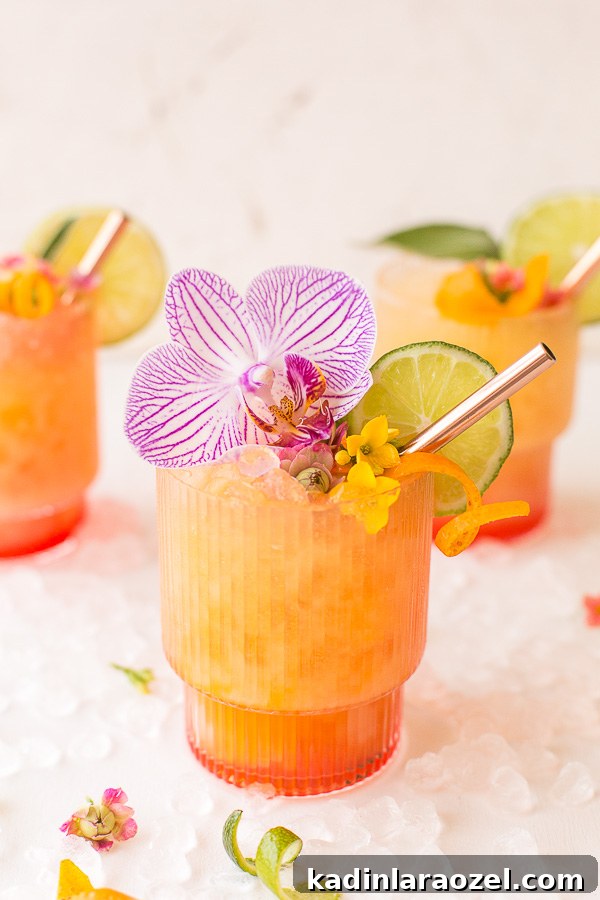Best of 2017 on Paper & Stitch: A Tropical Run Punch Recipe #cocktail #recipe #rum #punch #orchid #flowers #flowerpower
