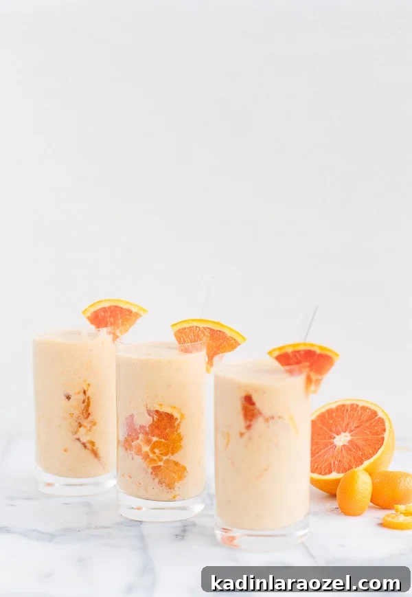 Creamsicle Smoothie Recipe with Fresh Orange and Yogurt 5 Pouring the creamsicle smoothie