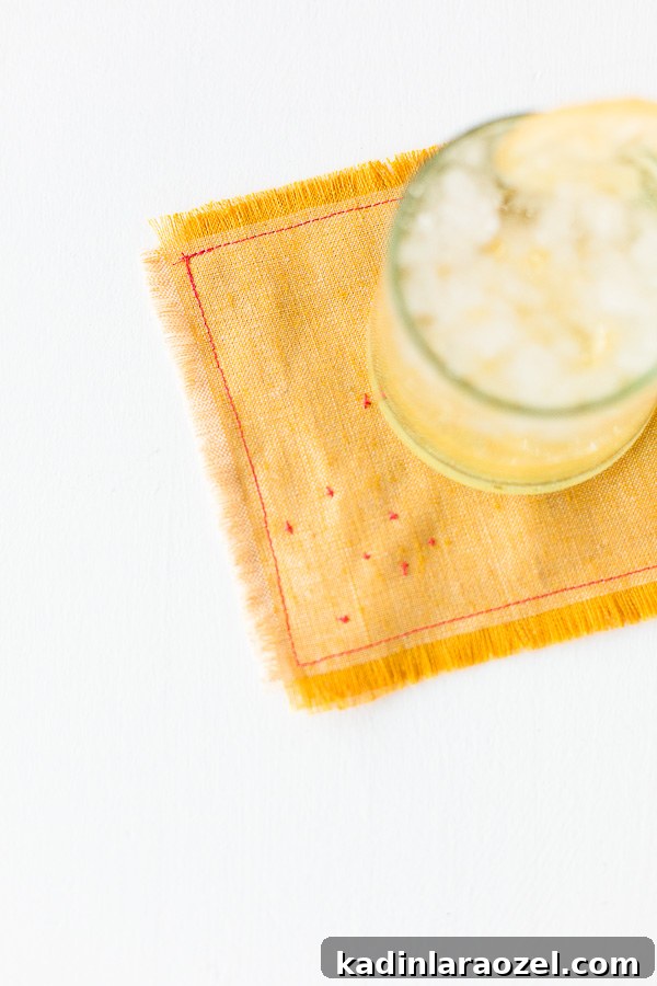 yellow linen cocktail napkin with drink resting on top