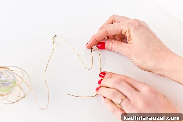 Wire Hand Necklace Tutorial: Beginner Soldering Project Guide 4 Bending a wire hand for unique necklace idea.