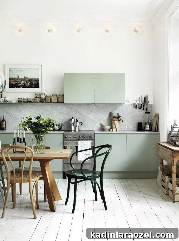 Why Sage Green Is Trending: 9 Reasons to Love the Shade 4 Photo of sage green cabinets in a modern meets transitional kitchen.