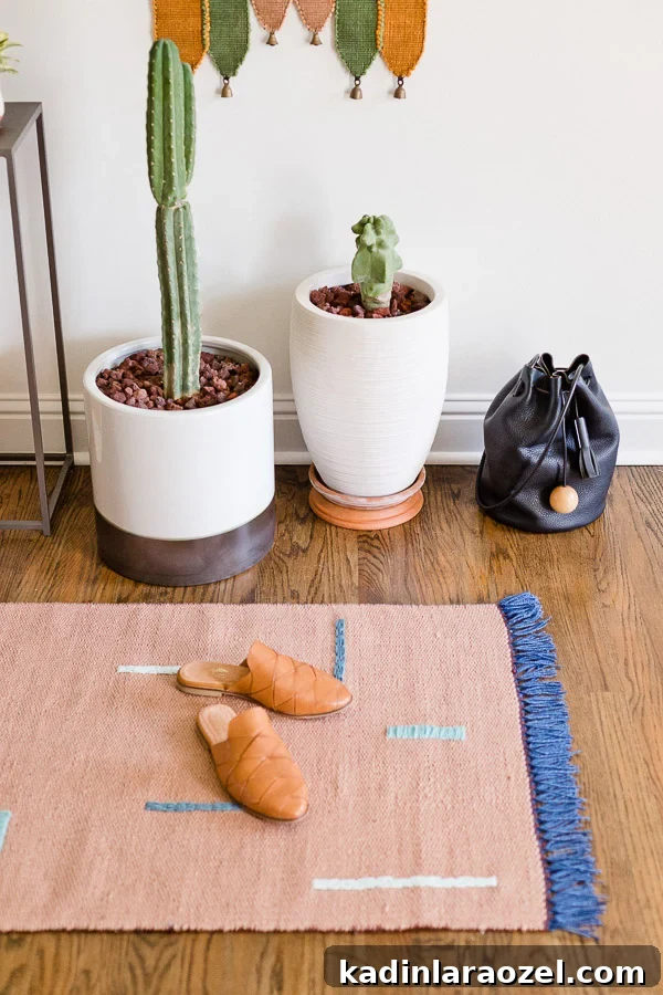 A DIY rug idea for your entryway! Customize a plain rug with any design you can dream up. Click through for the tutorial. #rug #diyrug #entryway #neutrals #interiors #californialiving