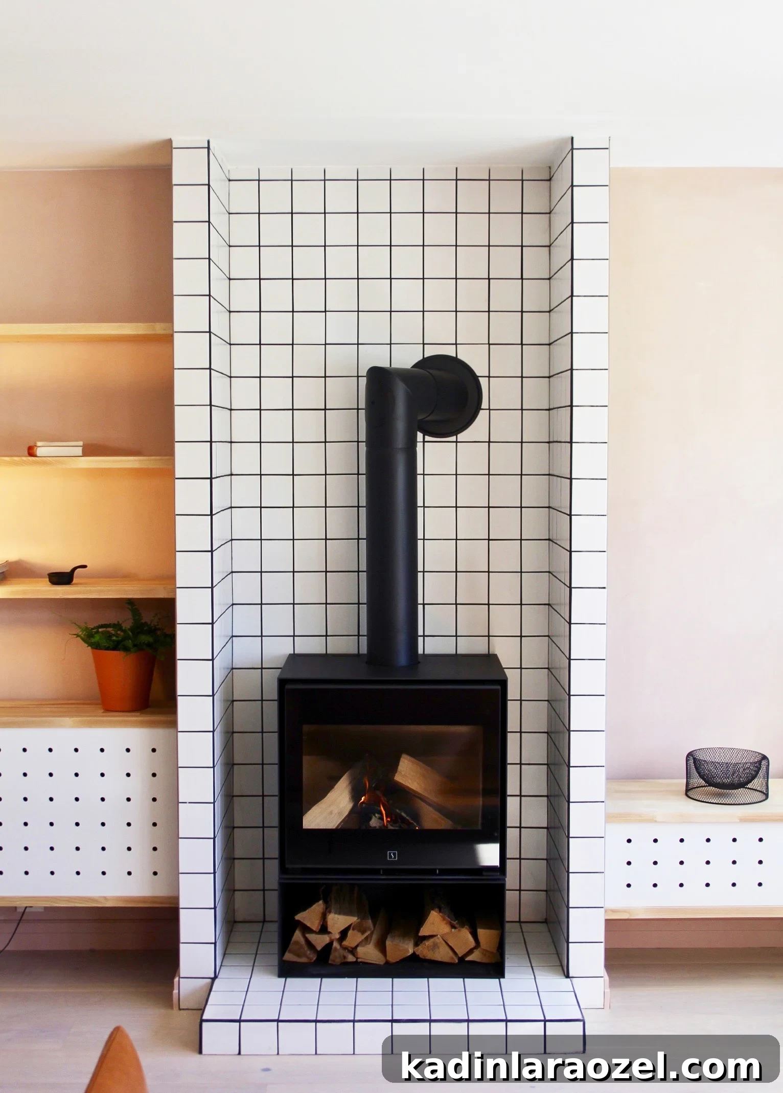 7 Stylish Ways to Use Wall Tile Beyond the Backsplash 3 Taking basic white tiles to the next level with this minimal, modern fireplace surround. Want more alternative tiling ideas? Click through for 7 unique and refreshing ways to use wall tiles. #tiling #tilework #interiors #minimal #uniquetilework