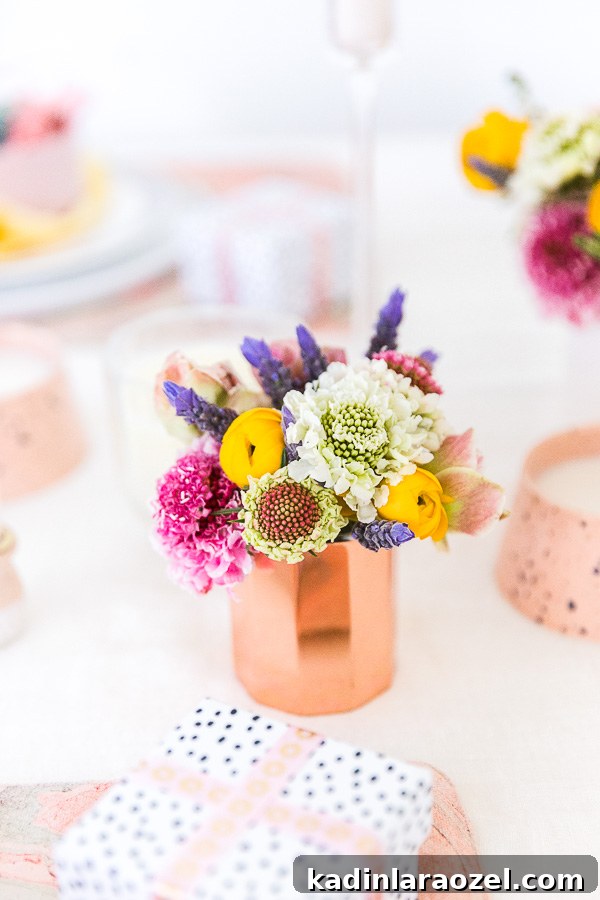 Spring Entertaining Idea: Make small floral centerpieces to scatter throughout the table, amongst candles. Click through for all 6 simple tablescape ideas for spring and Easter entertaining. #entertaining #modernentertaining #easter #pastels #flowerpower #floralcenterpiece #diy