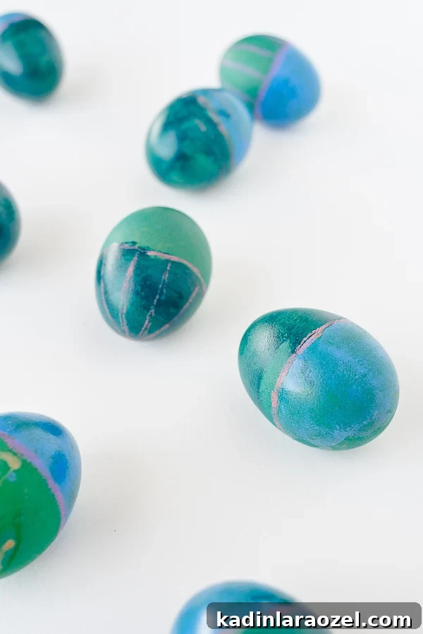 Abstract Easter egg designs in blue, green, and pink