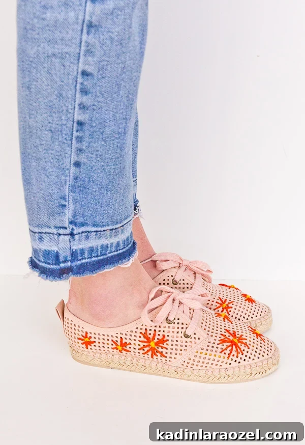 Embroidered floral detail.