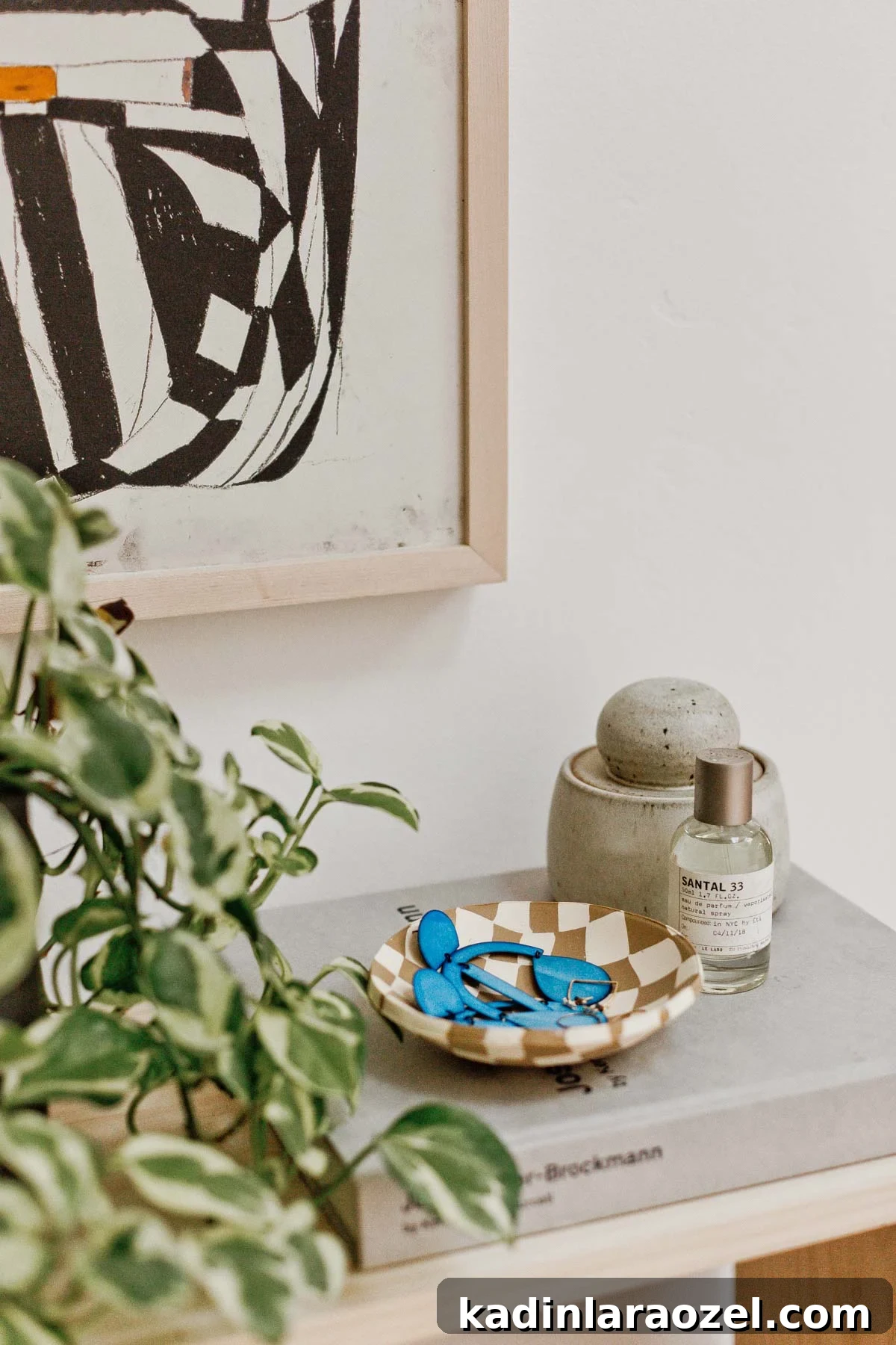 48 Unique DIY Mother's Day Gift Ideas for Cherished Moments 12 checked clay bowl on a stack of minimal books with perfume and ceramics
