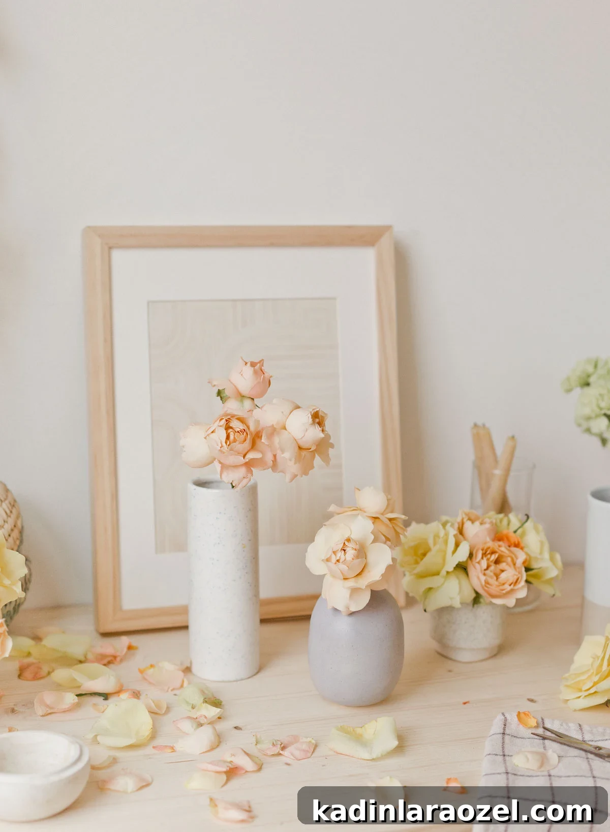 48 Unique DIY Mother's Day Gift Ideas for Cherished Moments 8 pastel flowers in various small vases with neutral artwork behind it