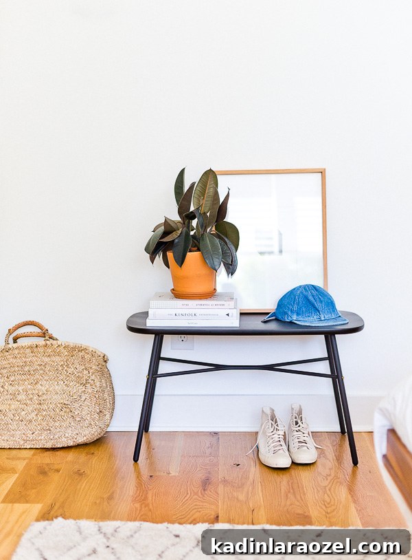 An organic modern bedroom makeover, with matte black accents. Love this bench especially. This is the home of lifestyle blogger, Brittni Mehlhoff of Paper and Stitch. #interiors #bedroominspo #organicmoderninteriors #organicmodernbedroom #bedroommakeover