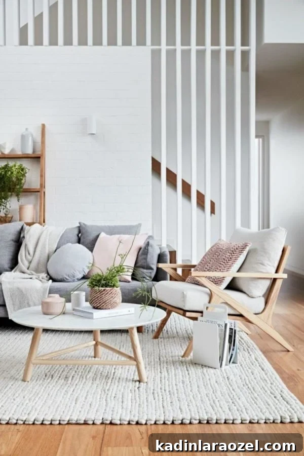 Modern Staircase Design Trend: Should You Upgrade Your Steps? 2 A white stair screen is added to an airy living room to add dimension. See how to 'Step Up Your Staircase Game with This Modern Design Trend' #staircase #stairs #stairscreen #moderndesign