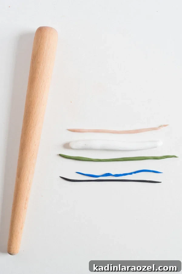 Make Clay Earrings: DIY Techniques to Craft Head-Turning Jewelry 4 Polymer clay laid out in strands of various colors with rolling pin