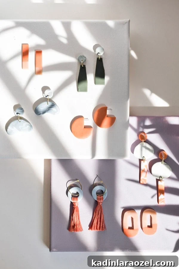 Make Clay Earrings: DIY Techniques to Craft Head-Turning Jewelry 9 DIY clay earrings sitting on a color blocked surface with tropical palm shadows.