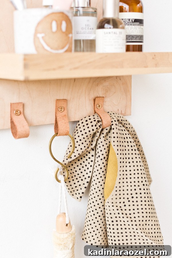 Modern DIY Bathroom Organizer with Built-In Mirror 4 Learn how to make a modern DIY bathroom organizer (with mirror) out of scrap plywood. Click through for the tutorial. #diybathroom #organicmodern #bathroomorganizer #diyorganizer #diy #woodproject #plywoodproject #modernbathroom