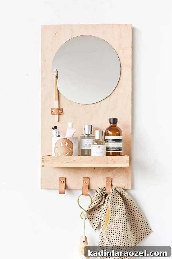 Modern DIY Bathroom Organizer with Built-In Mirror 5 Learn how to make a modern DIY bathroom organizer (with mirror) out of scrap plywood. Click through for the tutorial. #diybathroom #organicmodern #bathroomorganizer #diyorganizer #diy #woodproject #plywoodproject #modernbathroom