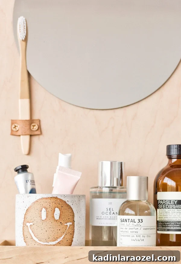 Modern DIY Bathroom Organizer with Built-In Mirror 6 Learn how to make a modern DIY bathroom organizer (with mirror) out of scrap plywood. Click through for the tutorial. #diybathroom #organicmodern #bathroomorganizer #diyorganizer #diy #woodproject #plywoodproject #modernbathroom