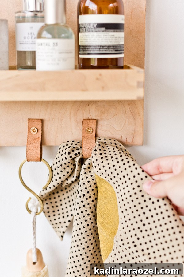 Modern DIY Bathroom Organizer with Built-In Mirror 8 Learn how to make a modern DIY bathroom organizer (with mirror) out of scrap plywood. Click through for the tutorial. #diybathroom #organicmodern #bathroomorganizer #diyorganizer #diy #woodproject #plywoodproject #modernbathroom