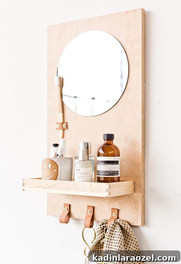 Modern DIY Bathroom Organizer with Built-In Mirror 9 Learn how to make a modern DIY bathroom organizer (with mirror) out of scrap plywood. Click through for the tutorial. #diybathroom #organicmodern #bathroomorganizer #diyorganizer #diy #woodproject #plywoodproject #modernbathroom