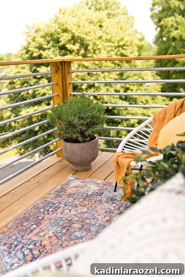 A balcony makeover perfect for summer entertaining or just reading a book. Click through for the full reveal and learn how to add privacy outdoors on a budget. #summer #outdoorspace #modernoutdoorspace