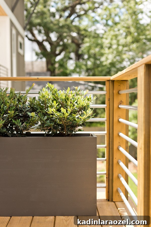 A balcony makeover perfect for summer entertaining or just reading a book. Click through for the full reveal and learn how to add privacy outdoors on a budget. #summer #outdoorspace #modernoutdoorspace