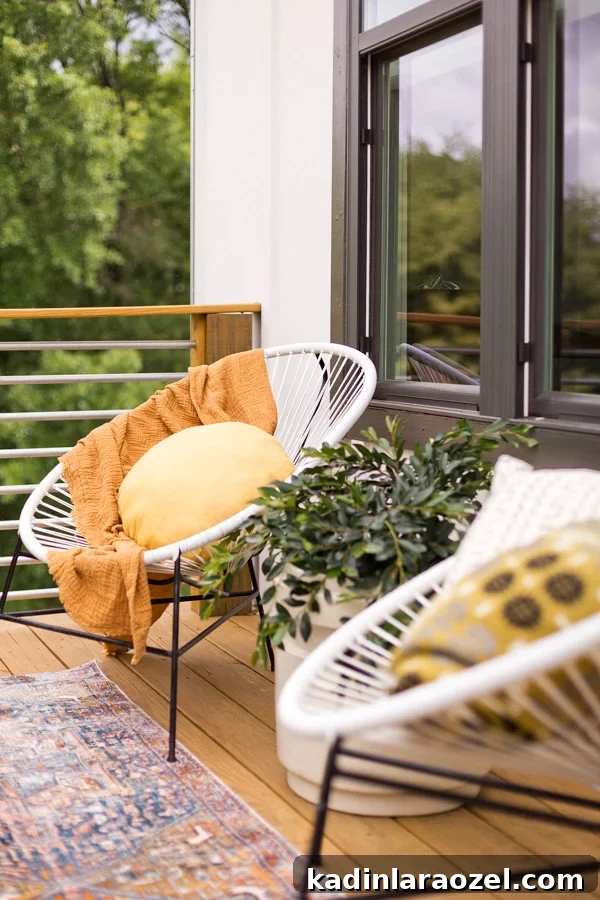A balcony makeover perfect for summer entertaining or just reading a book. Click through for the full reveal and learn how to add privacy outdoors on a budget. #summer #outdoorspace #modernoutdoorspace