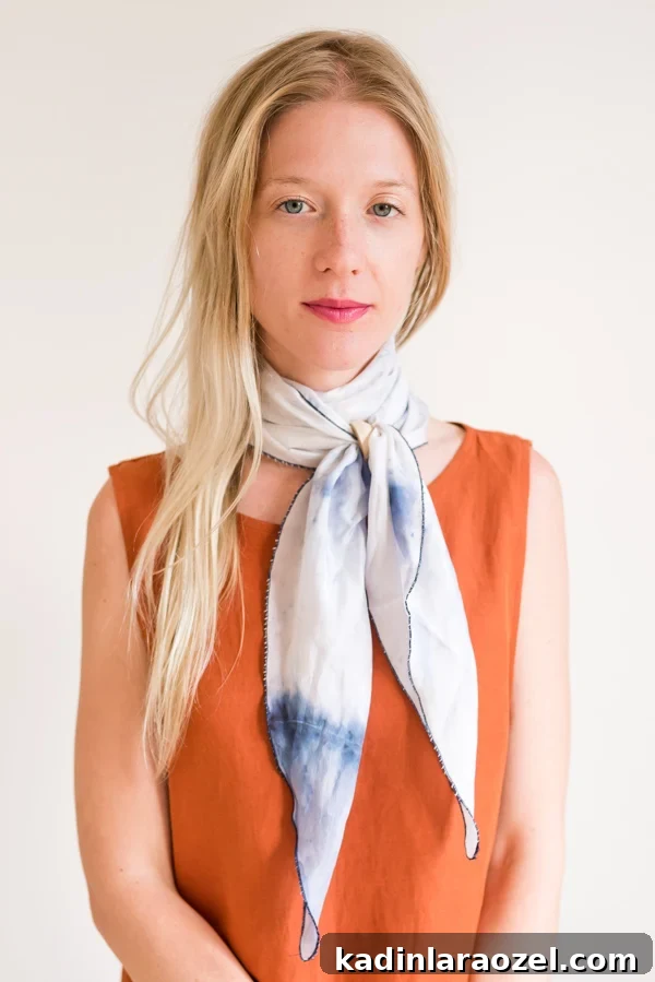 How to style 'the double wrap necktie'. Click through for all six ways to style a silk scarf, with step by step photos for recreating each look at home. #scarfstyling #howtostylescarf #silkscarf #fashiondiy #fashionstyling
