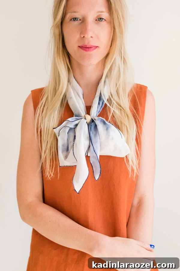 How to style 'the bowtie'. Click through for all six ways to style a silk scarf, with step by step photos for recreating each look at home. #scarfstyling #howtostylescarf #silkscarf #fashiondiy #fashionstyling