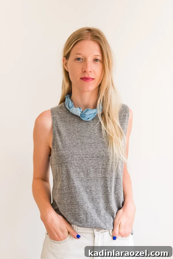 How to style 'the knotted necklace'. Click through for all six ways to style a silk scarf, with step by step photos for recreating each look at home. #scarfstyling #howtostylescarf #silkscarf #fashiondiy #fashionstyling