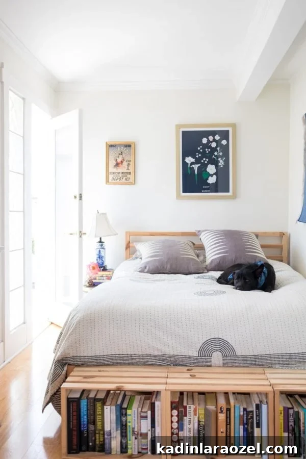 Minimal bedroom with storage at foot of bed in the form of wood crates that form a bench