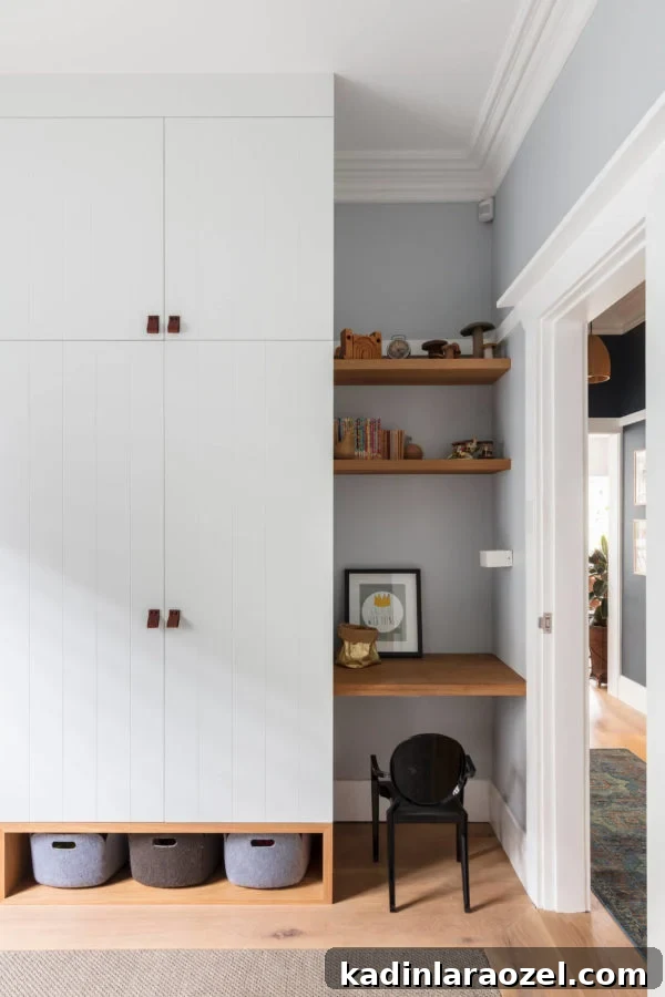 Large built in with closed door storage and baskets at the bottom - modern hardwood floors underneath