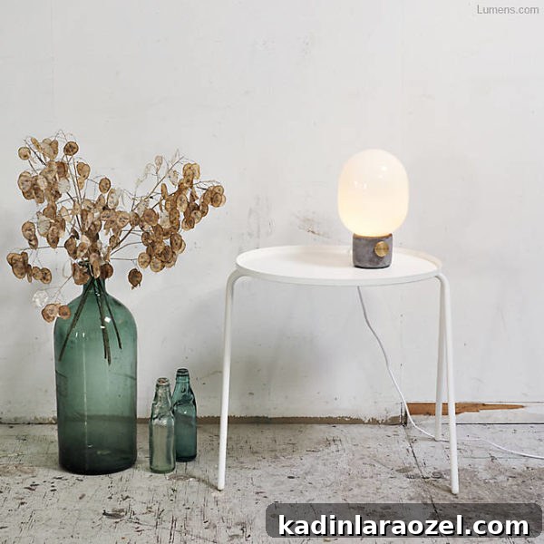 Modern concrete table lamp on white side table