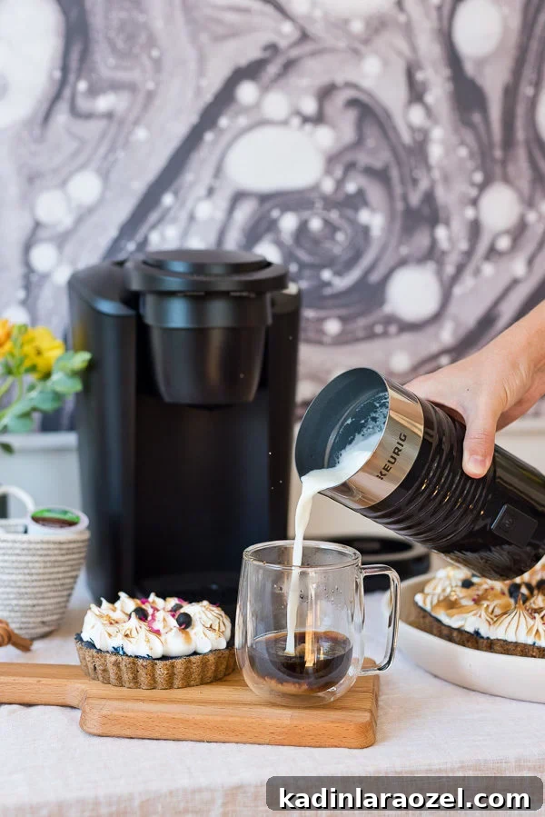 Host a Chic Brunch with Friends: Simple Stylish Ideas 6 Making lattes at home, with the Keurig K-Latte machine.