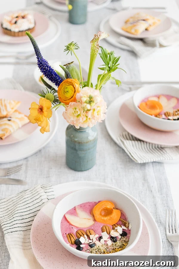 2-Ingredient Smoothie Bowls You Can Make in Minutes 6 Breakfast table with white linen table cloth and pastries placed at each table setting.